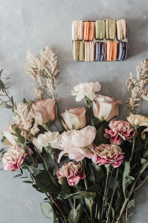 a vase filled with white and pink flowers