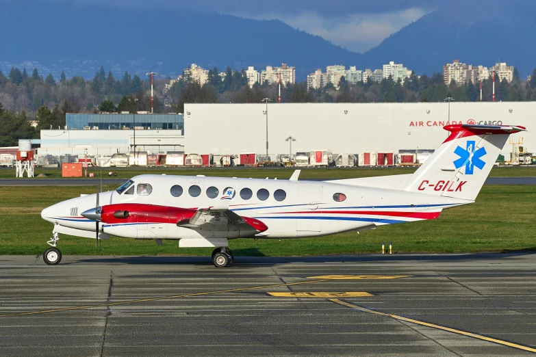 a large propeller airplane on an airport runway