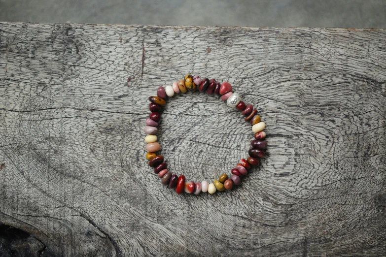 a close up of a small bead on top of wood