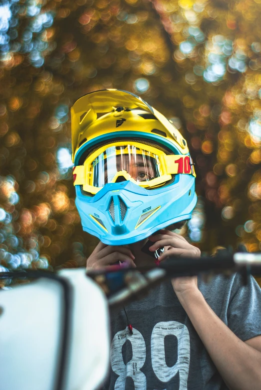 a close up of a person wearing a motorcycle helmet