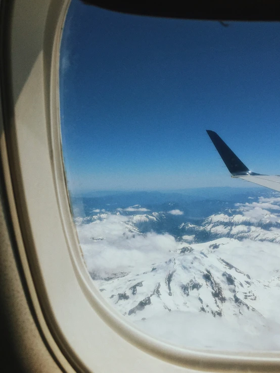 a plane wing with the sky behind it