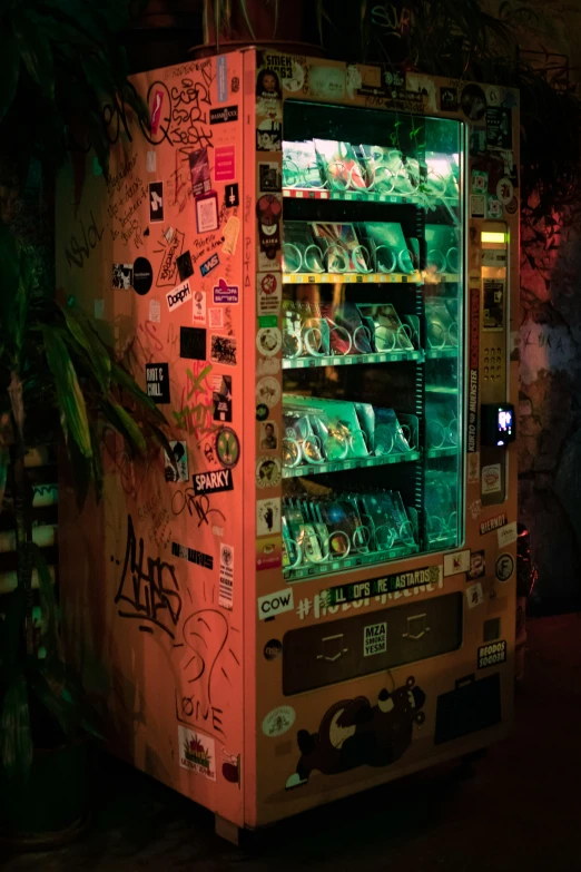 a vending machine with lots of drinks on the front