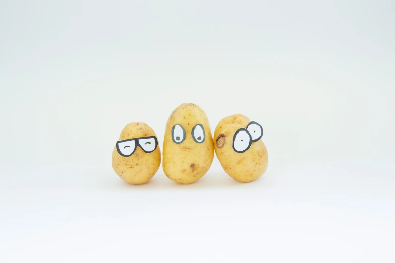 three potato characters with glasses on them