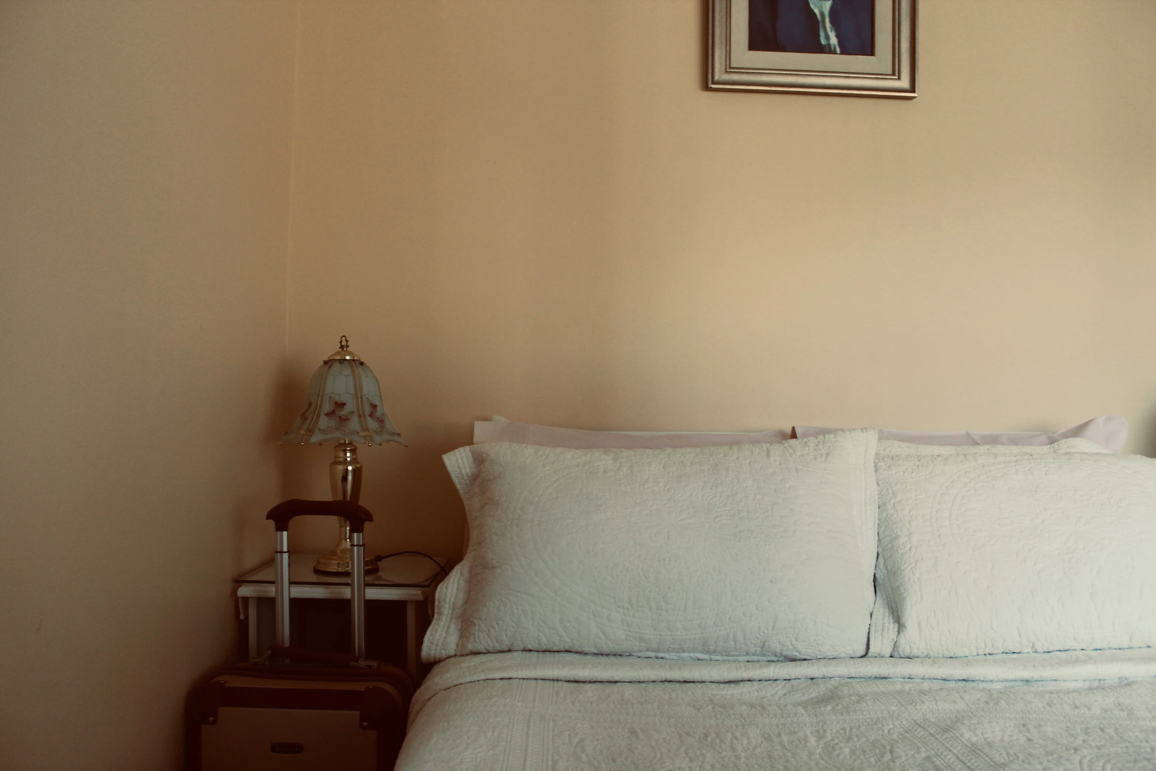 the bedroom has two lamps on both sides of the bed