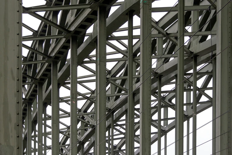 looking down at the metal beams of a steel structure