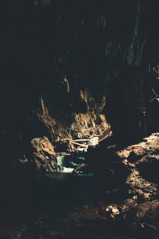 the cliff in the dark has small stream flowing through