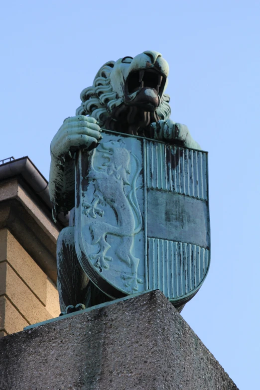 a lion statue on the side of a building