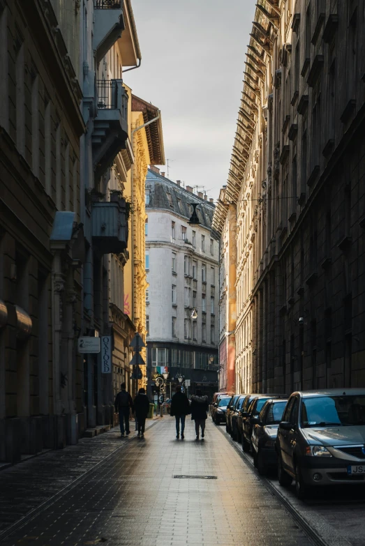 a group of people walking down a city street