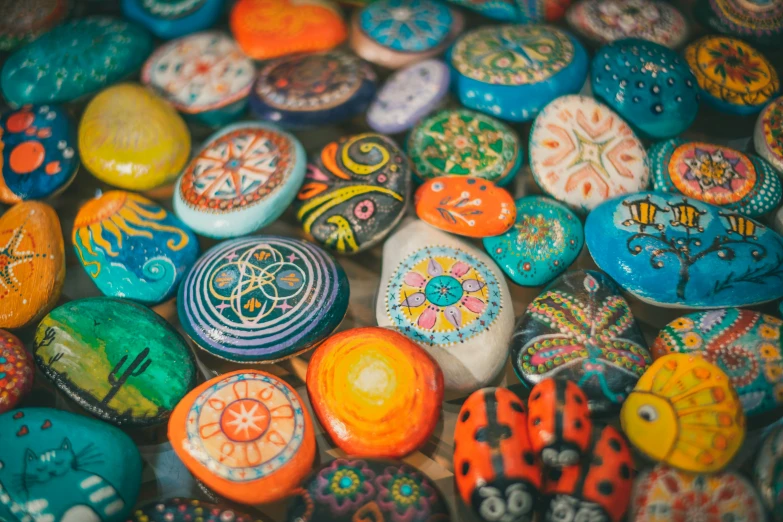 a group of painted rocks laying next to each other