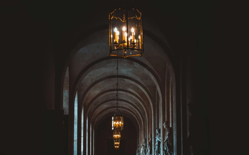 a couple people standing in front of a light