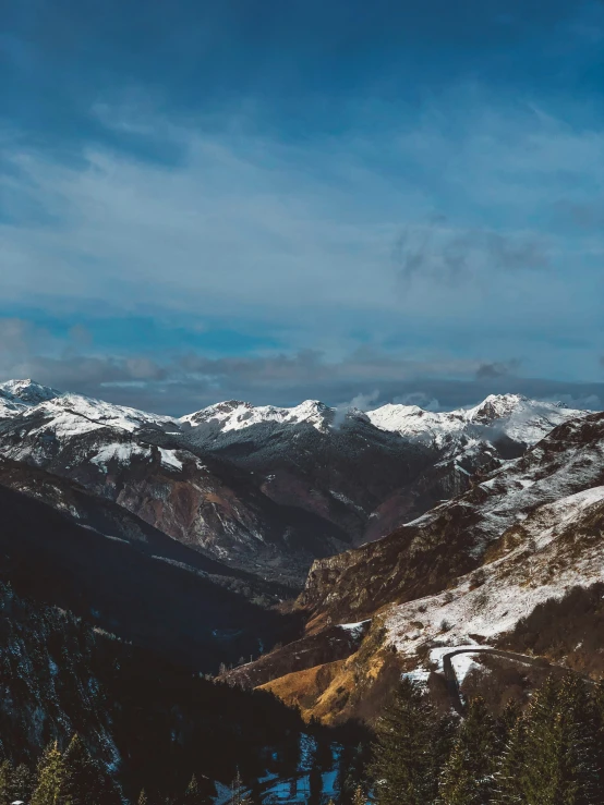 a snow covered mountain view with snow capped mountains