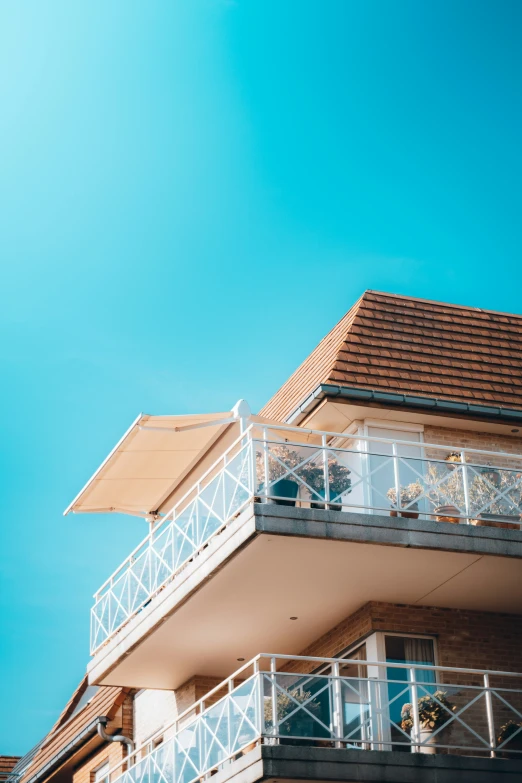 some windows and balconies on a tall building