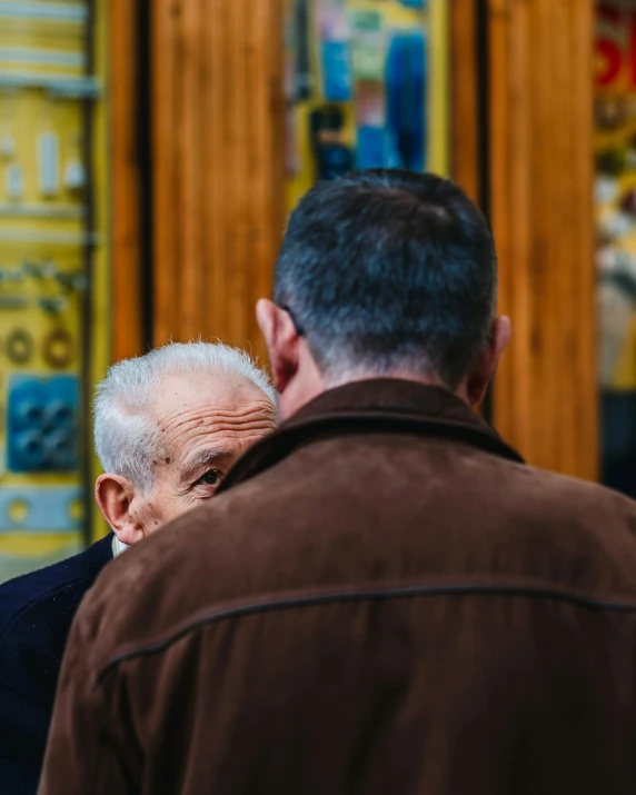 two people standing near each other outside