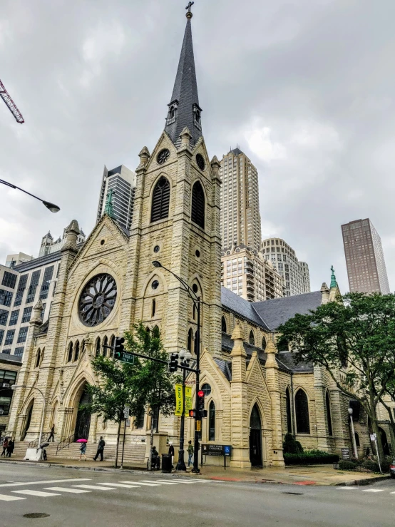 a very tall building with lots of windows and a spire