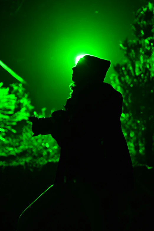 a person playing the violin with a green background