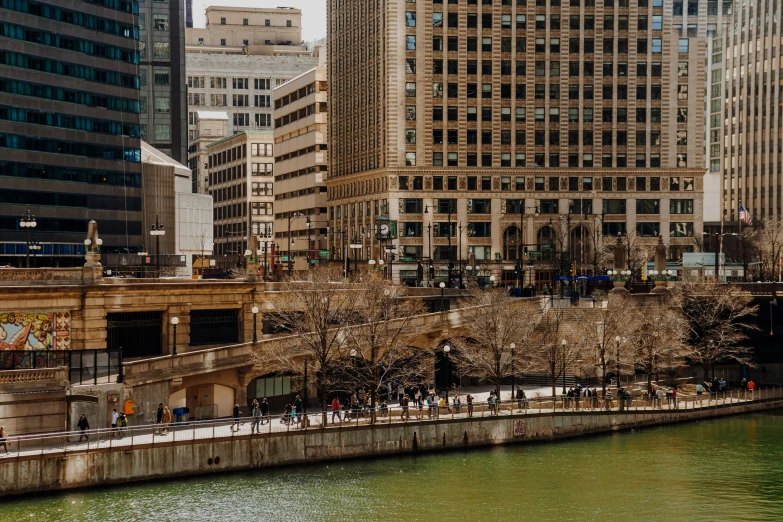 the street sign for a store on the side of a river in a city