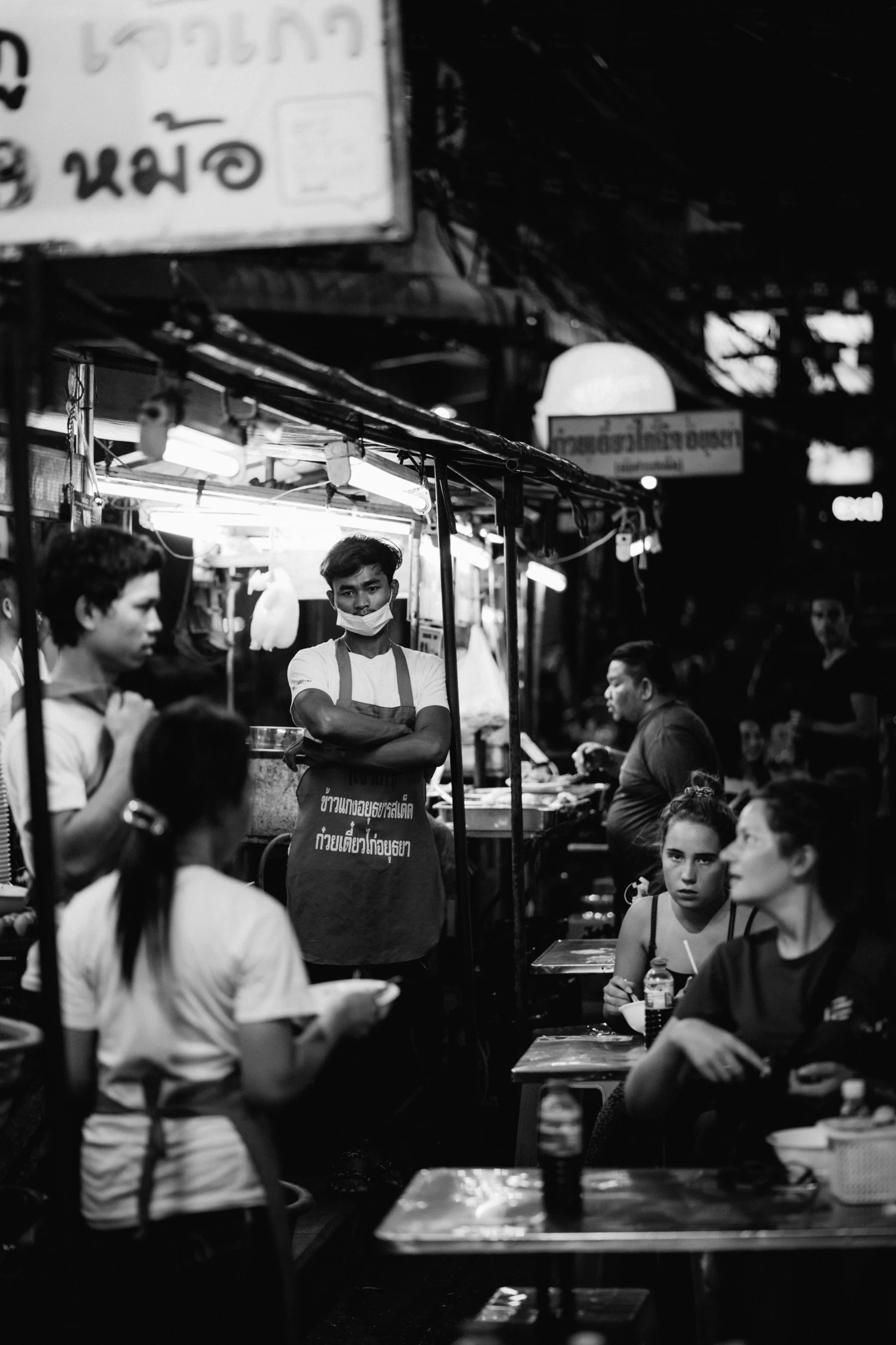 black and white pograph of a busy asian restaurant