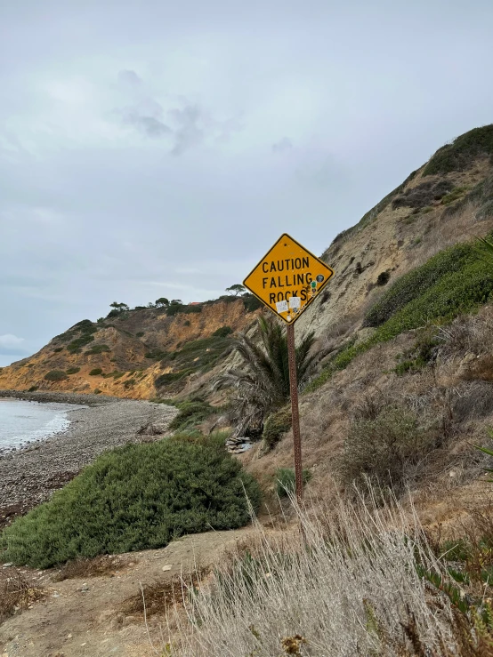 a road sign saying warning ahead to walking