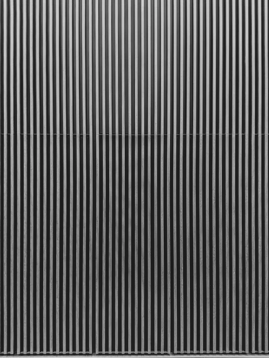 a black and white image of vertical lines