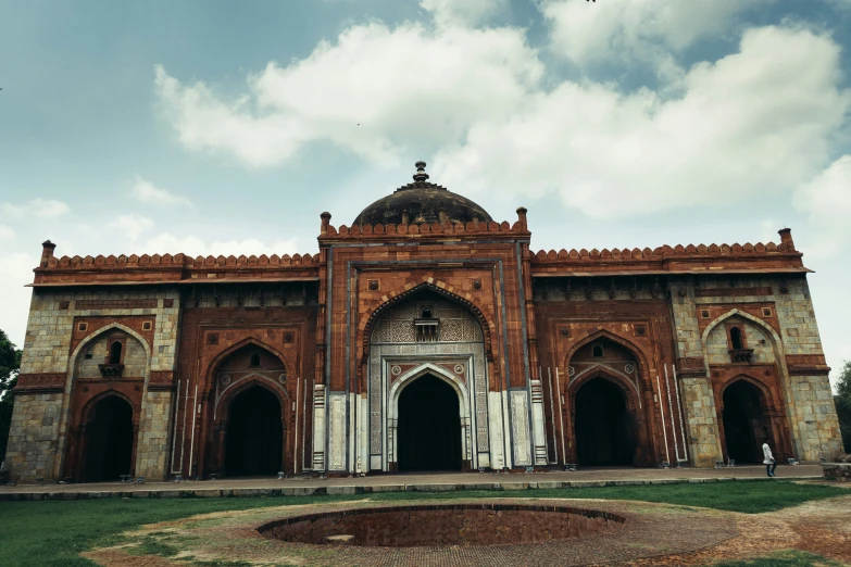 an old looking building with an ornate archway