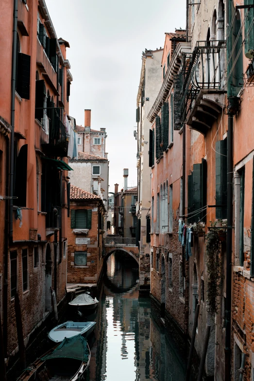 an alleyway with a bunch of boats in it