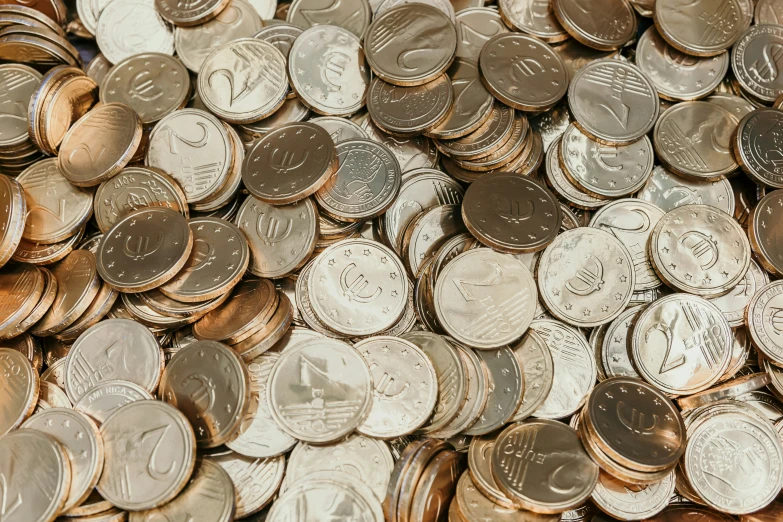 a pile of different size and type coins