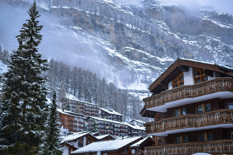 a snow covered town nestled in a mountain range