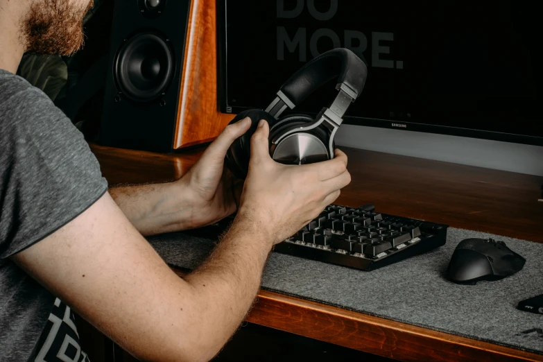 a man sitting at a desk with a computer