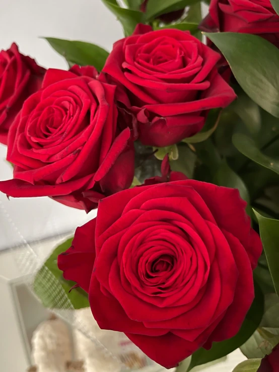 a bouquet of red roses in a vase