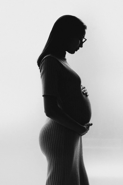 a pregnant woman is shown with the light on her stomach