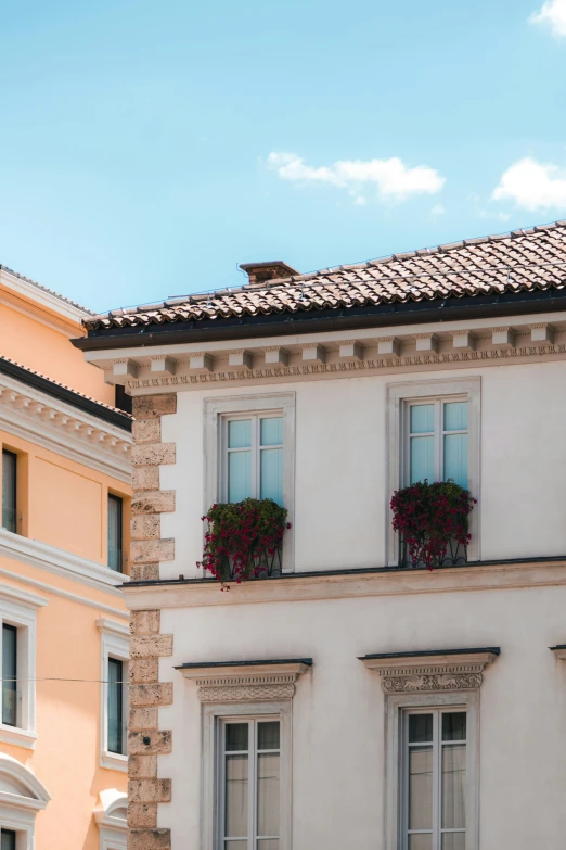 a picture of a building with three different windows