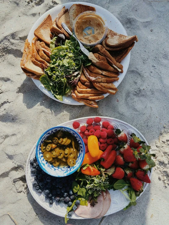 two plates of food are laying on the ground