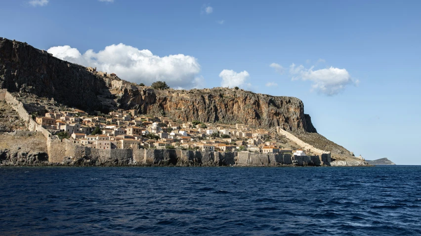 several buildings are on the side of an island