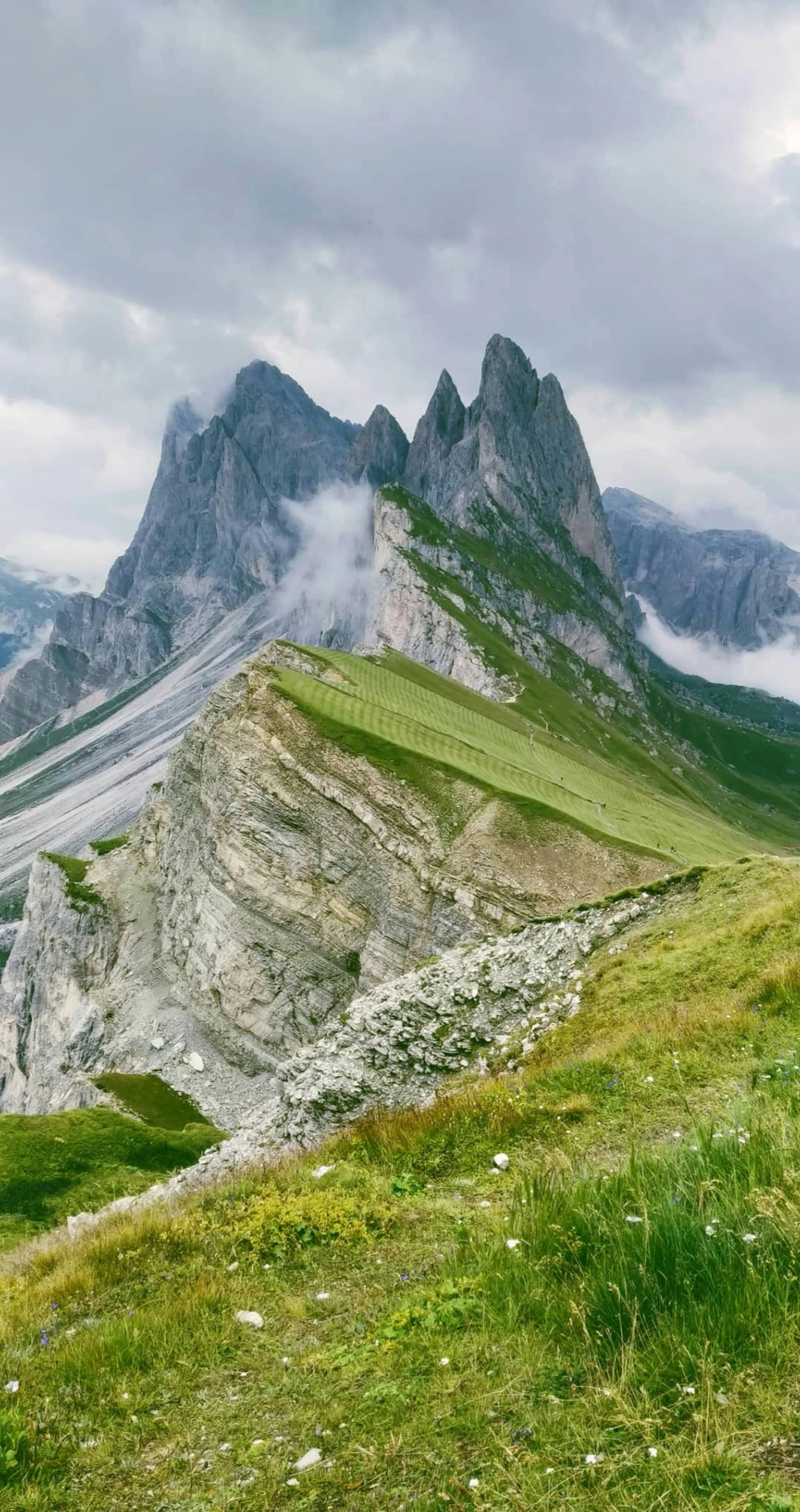 mountains under a cloudy sky with some clouds