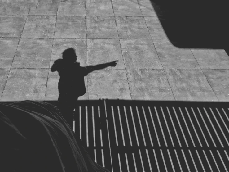 a young child holding onto an umbrella and standing on a bench