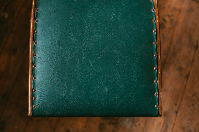 green leather covered lunch box with handles in use