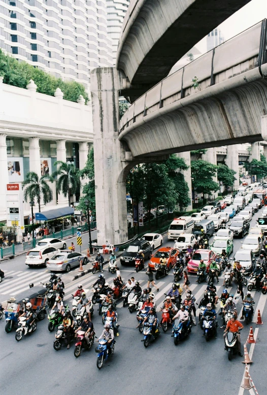 a street filled with lots of traffic near tall buildings