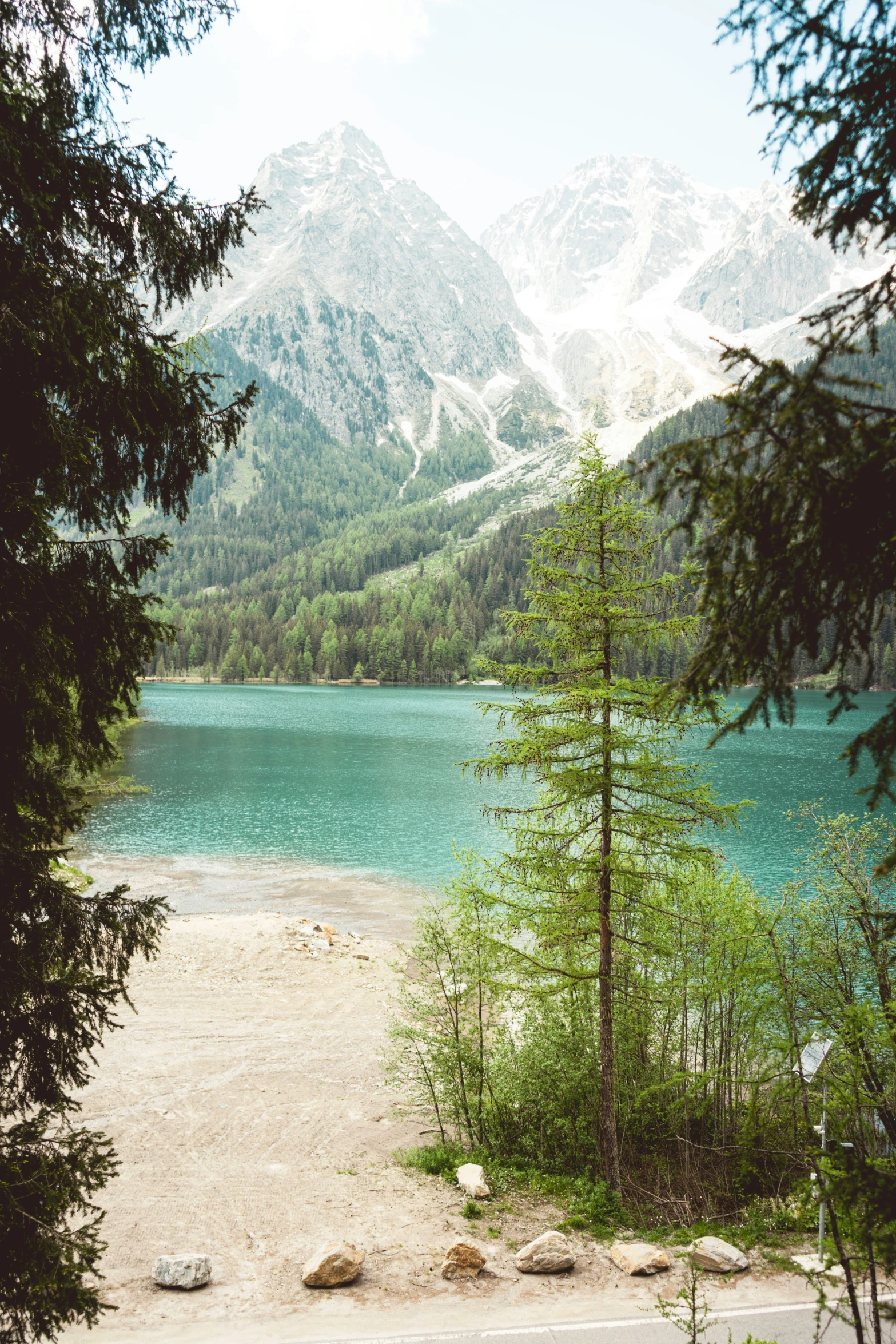 the view of the mountains from behind the lake