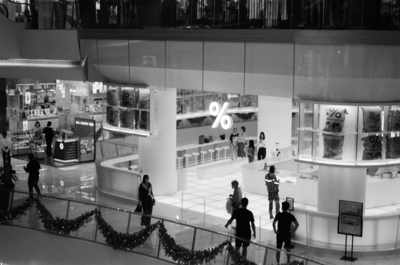 a black and white po of people standing outside of a building