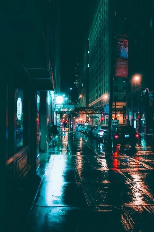 traffic lights at night in a downtown area on the city street