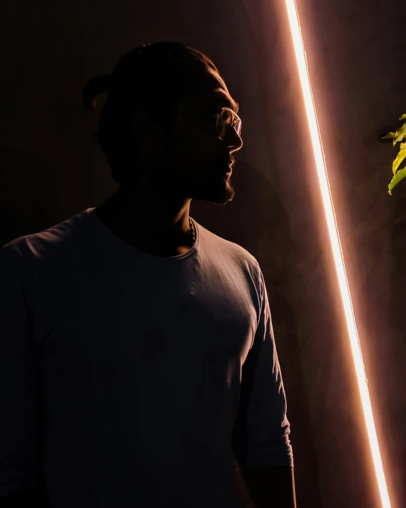 a man that is standing in front of some lights