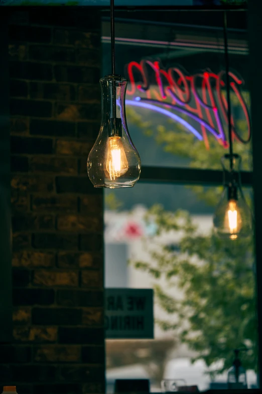 a light bulb sitting on top of a window in front of a building