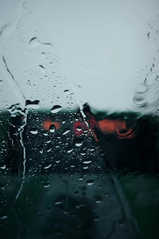 the side window of a car during a rain storm