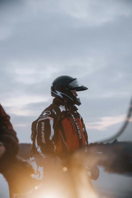 a person riding a motorcycle while wearing a helmet