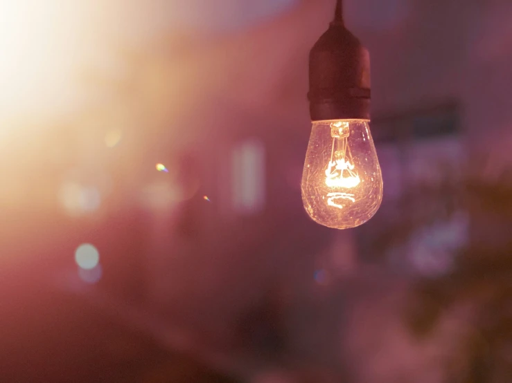 a light bulb is lit on an outdoor walkway