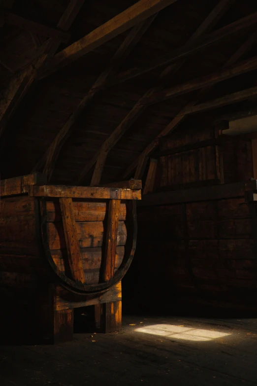 a wine barrel sits on the floor in a cellar