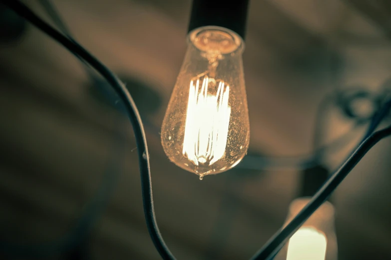 a hanging light bulb with some lights attached