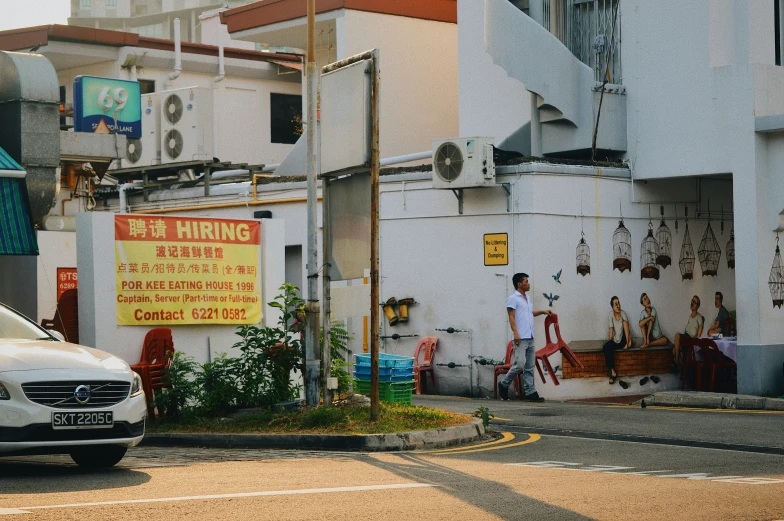 a building has people and various signs on the front