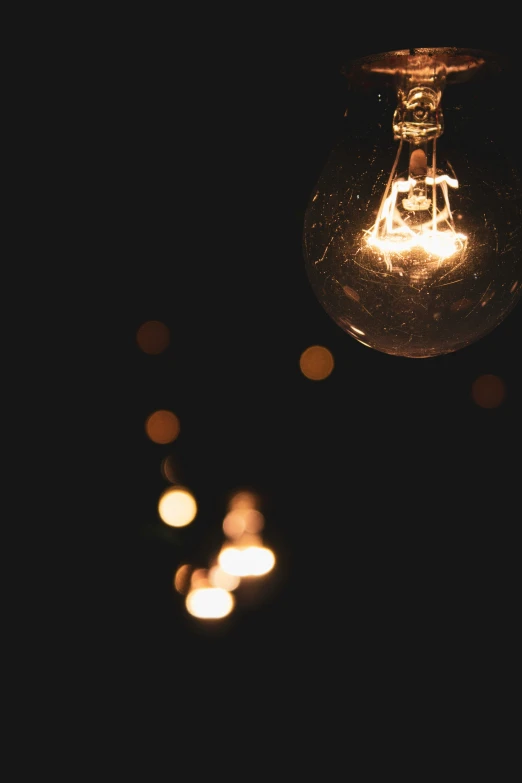 a close up of some glowing lights with one light turned on