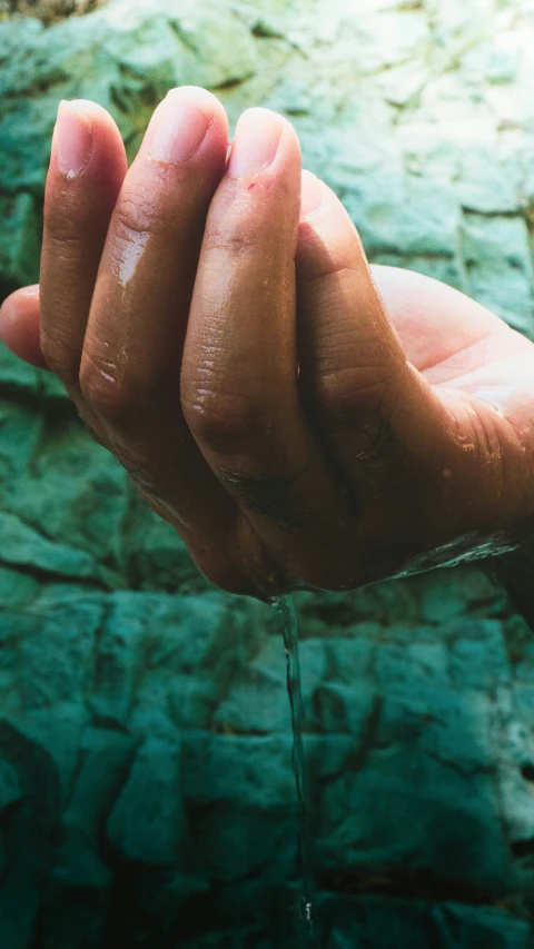 a person holding an unripe knife with their hands